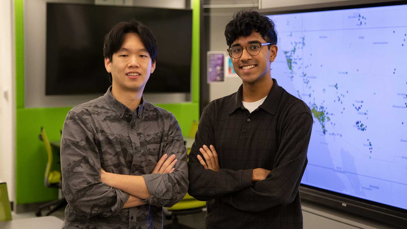 Biokind Analytics standing in a lab with their owns crossed